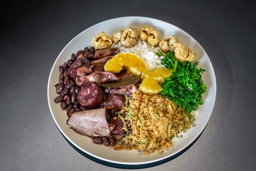 The best traditional Brazilian feijoada completely served in the most authentic style accompanied by the irresistible and iconic cachaça caipirinha