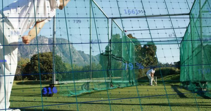 Data grid appearing over cricket net guiding training bowler running in and batsman defending shot