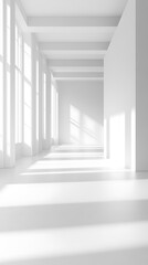 Sunlight streams into a vast, empty white building interior with pillars and minimalist design