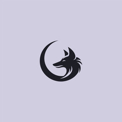 Jackal and moon logo in clean and mystical silhouette design.
