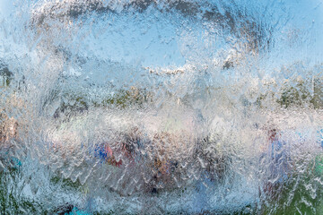 Aqua background. Product space next to clean water streams and water splashes and drops.