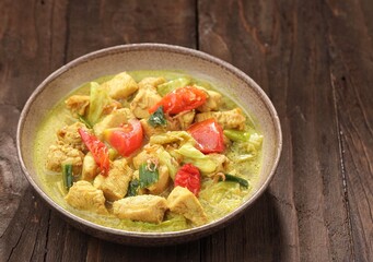Tongseng ayam is a typical Indonesian dish made from pieces of chicken cooked in a thick, spiced sauce