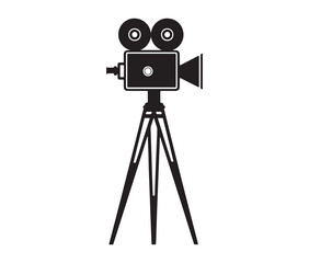 Silhouette of an old movie camera on a tripod. Vintage movie camera on tripod silhouette.