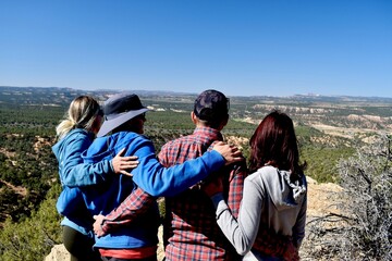 St. George, Utah.  Gorgeous Snow Canyon State Park. near red mountain resort.  Friends embrace and hug. Explore, hike, camp, stargaze, rock climb. Spectacular vista sky views and amazing trails.