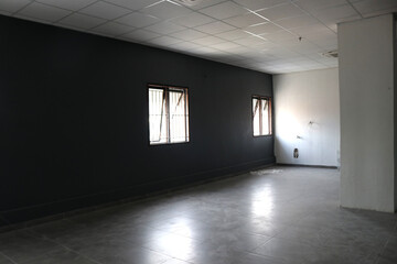 Photo of a dark empty room in an abandoned building
