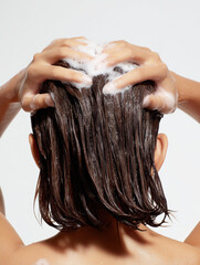 woman with short hair shampooing 