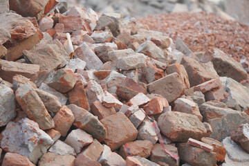 Pile of bricks and rubble at a construction site in daylight