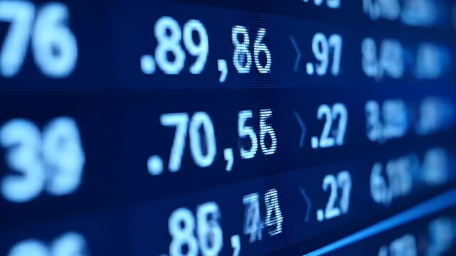 Close up of a modern digital display with financial data showing stock market indicators