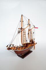 wooden sailing ship model in white background