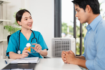 Doctor, female pharmacist holding a medicine bottle, gives advice, recommends how to take medicine...