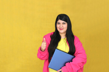 A successful and empowered 30-year-old Latina brings her laptop to study and work remotely