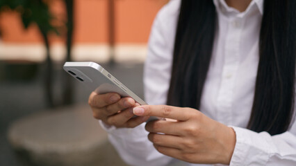 Close up Asian Korean Chinese Japanese woman hands holding user mobile phone smartphone cellphone...