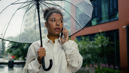 African American woman talk mobile phone smartphone boss employee upset female girl city call...