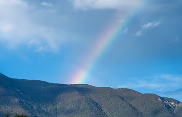 Huge Rainbow Over Green Mountains