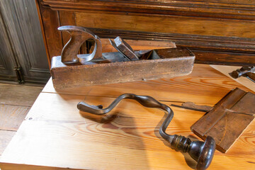 Vintage carpenters tool set. Brace, wood plane, hammer and square. Wooden tools.