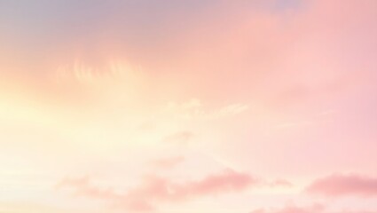 Soft pastel sky with wispy clouds and a gradient of pink and yellow hues.