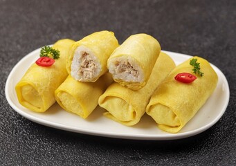 Semar Mendem is an Indonesian savoury snack made of glutinous rice filled with seasoned shredded chicken, fish abon (meat floss) or serundeng wrapped in a thin omelet