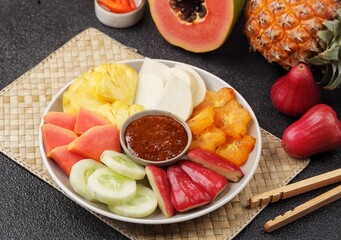 Rujak buah. Fruit Rujak or Indonesian fruit salad is a fresh fruit dish enjoyed with addictive peanut sauce.