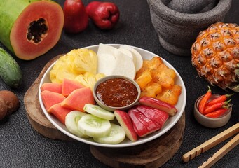 Rujak buah. Fruit Rujak or Indonesian fruit salad is a fresh fruit dish enjoyed with addictive peanut sauce.
