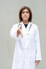 Transgender non binary doctor with stethoscope
