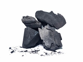 Natural wood charcoal is traditional charcoal made using hardwood isolated on a white background....
