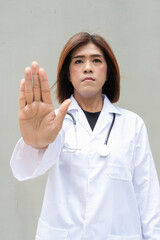 Transgender non binary doctor with stethoscope