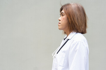 Transgender non binary doctor with stethoscope