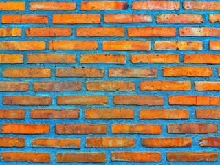 Red brick wall texture background. A patterned red brick wall texture arranged aesthetically. Red...