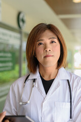 Transgender non binary doctor with stethoscope