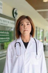 Transgender non binary doctor with stethoscope