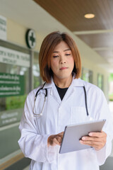 Transgender non binary doctor with stethoscope