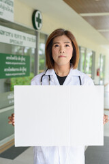 Transgender non binary doctor with stethoscope