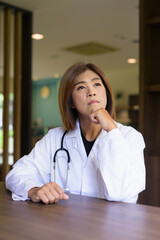 Transgender non binary doctor with stethoscope
