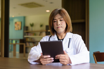 Transgender non binary doctor with stethoscope