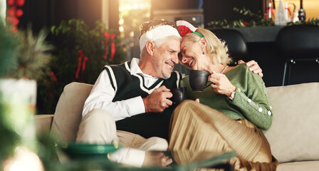 Senior, happy couple or tea with hug for Christmas, love or romance in festive season in home. Smile, marriage support or elderly people bonding on sofa in lounge for holiday, care or coffee beverage