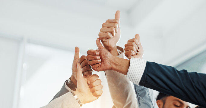Hands, goal or business people with thumbs up in office for good job, company or well done. Group, staff or employees in meeting with team, positive support or yes sign for skills review or success