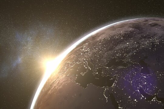 Fototapeta Sun rising behind planet Earth