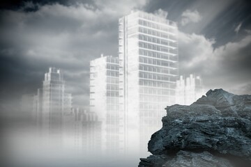 Large rock overlooking outline of city