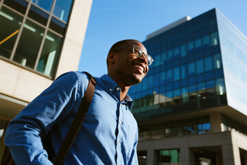 Fototapeta premium Smiling Businessman Walking in City