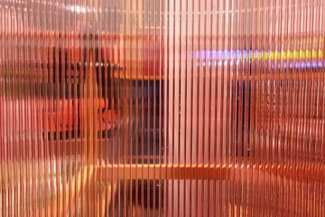 Red Vertical Glass Striped Wall Background with Reflection Stair.