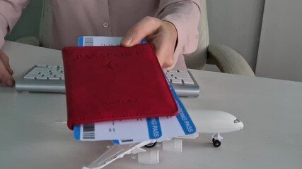 Planning a business trip with a model airplane and smartphone at the desk