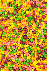 Candy gummy fruits multi flavour sweets colourful background