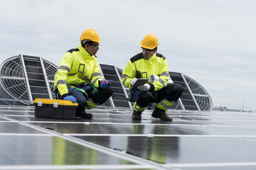 Solar panel, Solar grid tie system on rooftop of building, Solar power system. Team of engineer or...