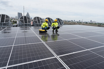 Solar panel, Solar grid tie system on rooftop of building, Solar power system. Team of engineer or...