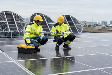 Solar panel, Solar grid tie system on rooftop of building, Solar power system. Team of engineer or...
