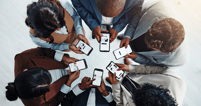 Business people, meeting or huddle with phone in circle above for network or data sync in office. Screen, group or employees browsing with mobile smartphone for information, research or sharing app
