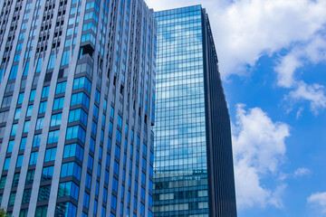 A cityscape of moving cloud reflecting the office building at the business town