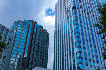 A cityscape of moving cloud reflecting the office building at the business town