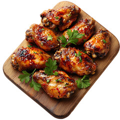 Grilled chicken wings with herbs and glaze on wooden board isolated on transparent background