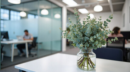 Eucalyptus Arrangement in Glass Vase inside Modern Office Conference Room
